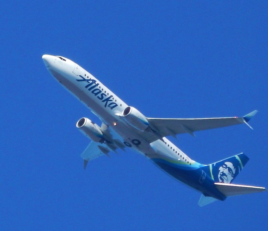Boeing 737 with double-edged winglets. Alaska Airlines jet climbing over Federal Way, WA after departing Seatac Airport.