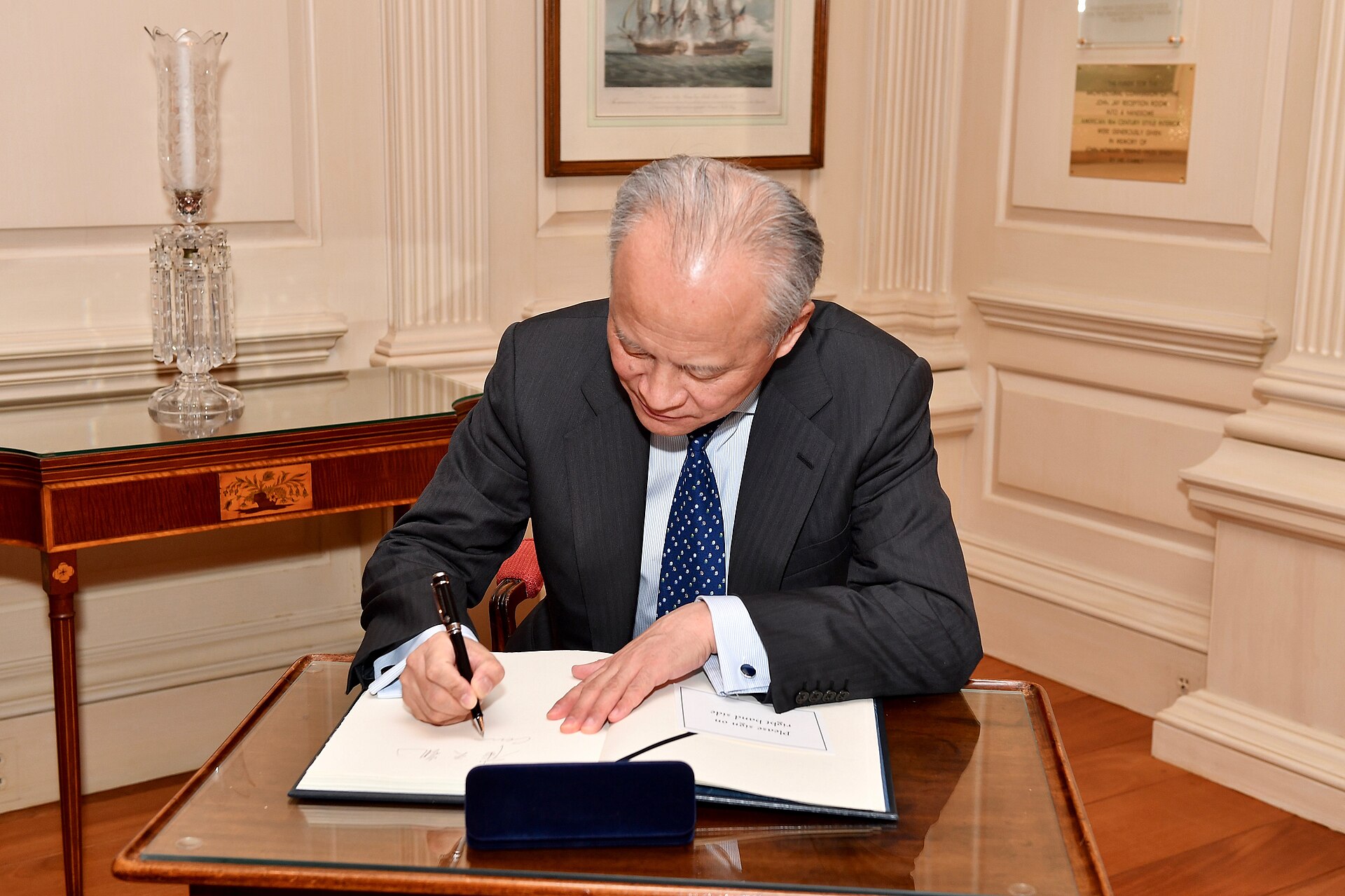 Chinese Ambassador to the United States Cui Tiankai signs the State Department guestbook before his meeting with Acting Secretary of State John…